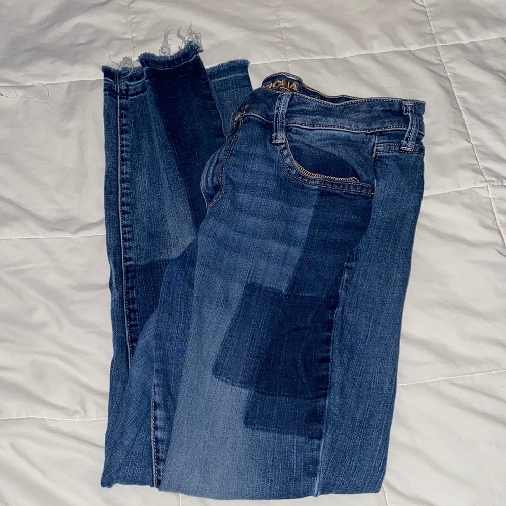 Dark blue patched skinny jeans.